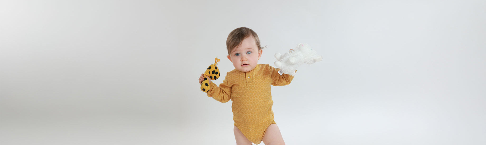 Baby med Janus ullbody, gull