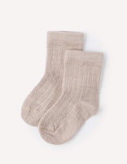 A pair of beige melange Socks – Merino Baby Light, featuring a ribbed knit design and durable construction, is neatly laid out on a plain white background.