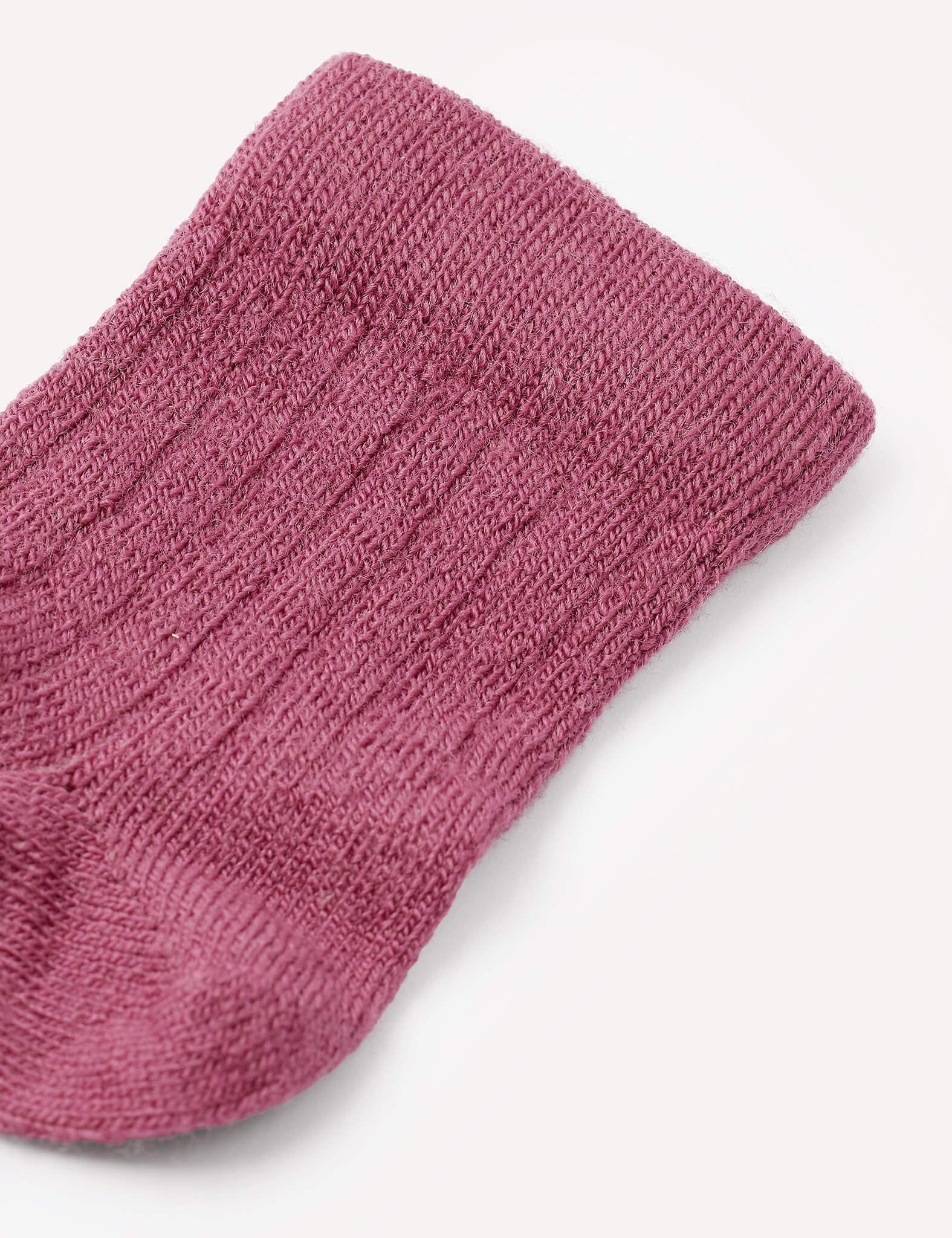 A close-up of the top portion of the Socks – Merino Baby Light in textured, ribbed purple wool, shown against a plain white background.