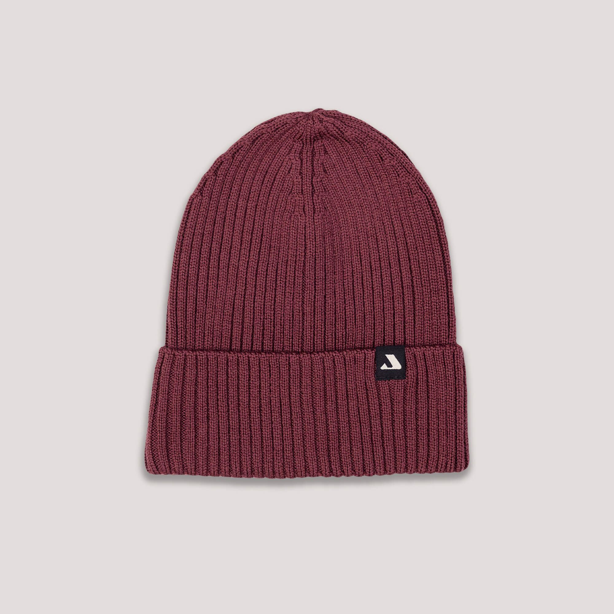 Burgundy beanie with Janus Wool logo on a light gray background