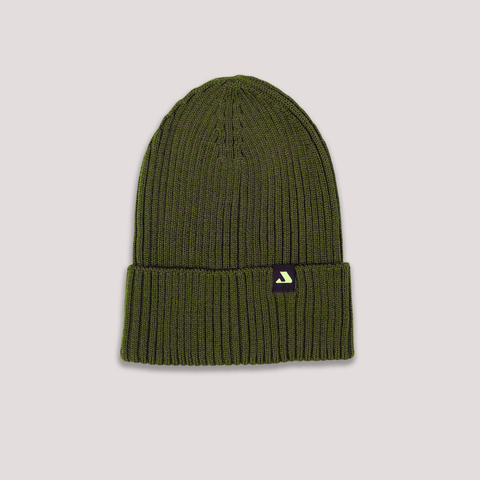 Green knit beanie with Janus Wool logo on a light gray background