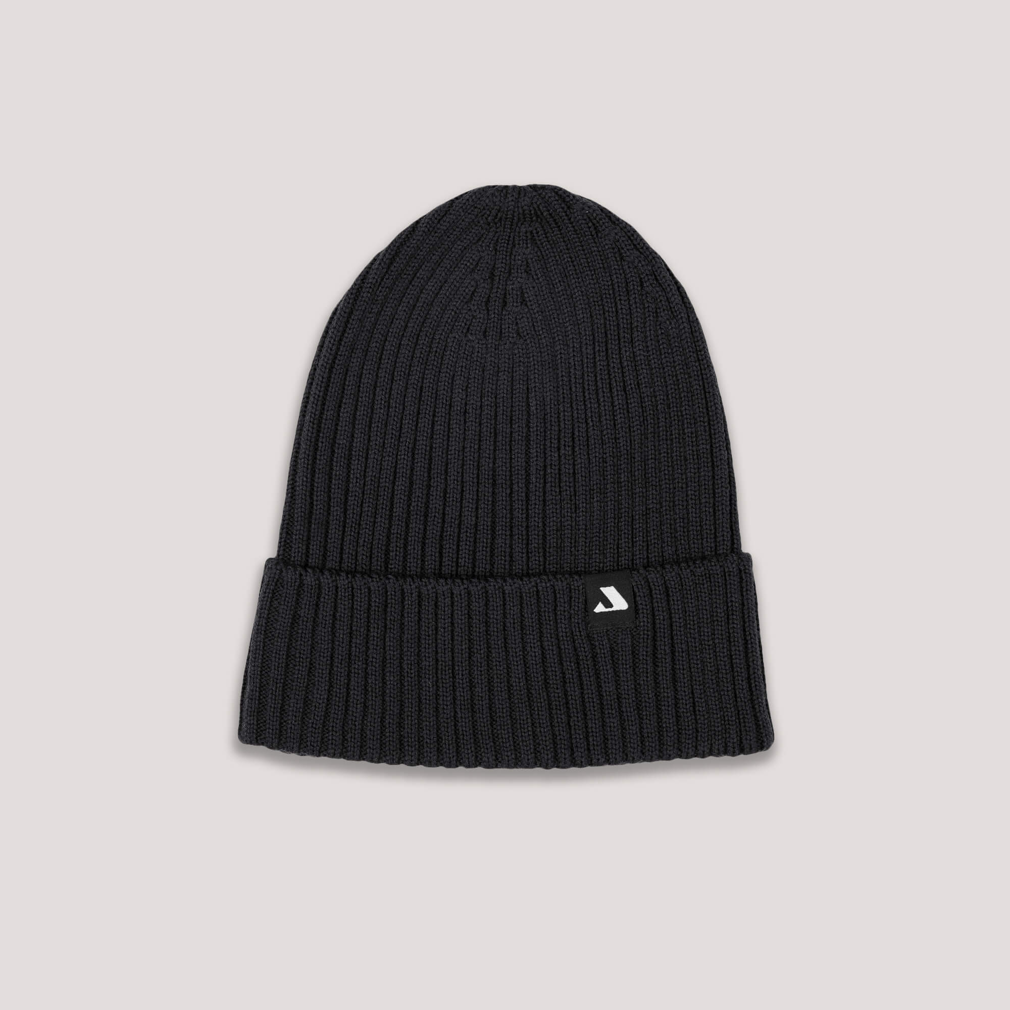 Black knit beanie with Janus Wool logo on a light gray background