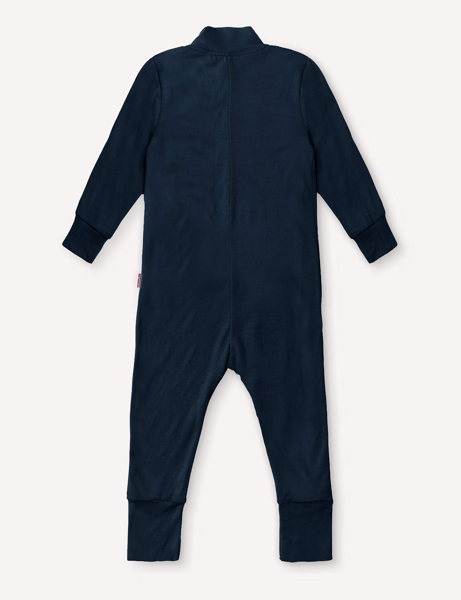 A rear view of the Pyjamas – Merino Baby Light is displayed in navy blue, featuring long sleeves and legs with cuffed wrists and ankles, along with a collar at the neckline. Designed as breathable sleepwear, these merino pyjamas provide comfort for your baby throughout the night.