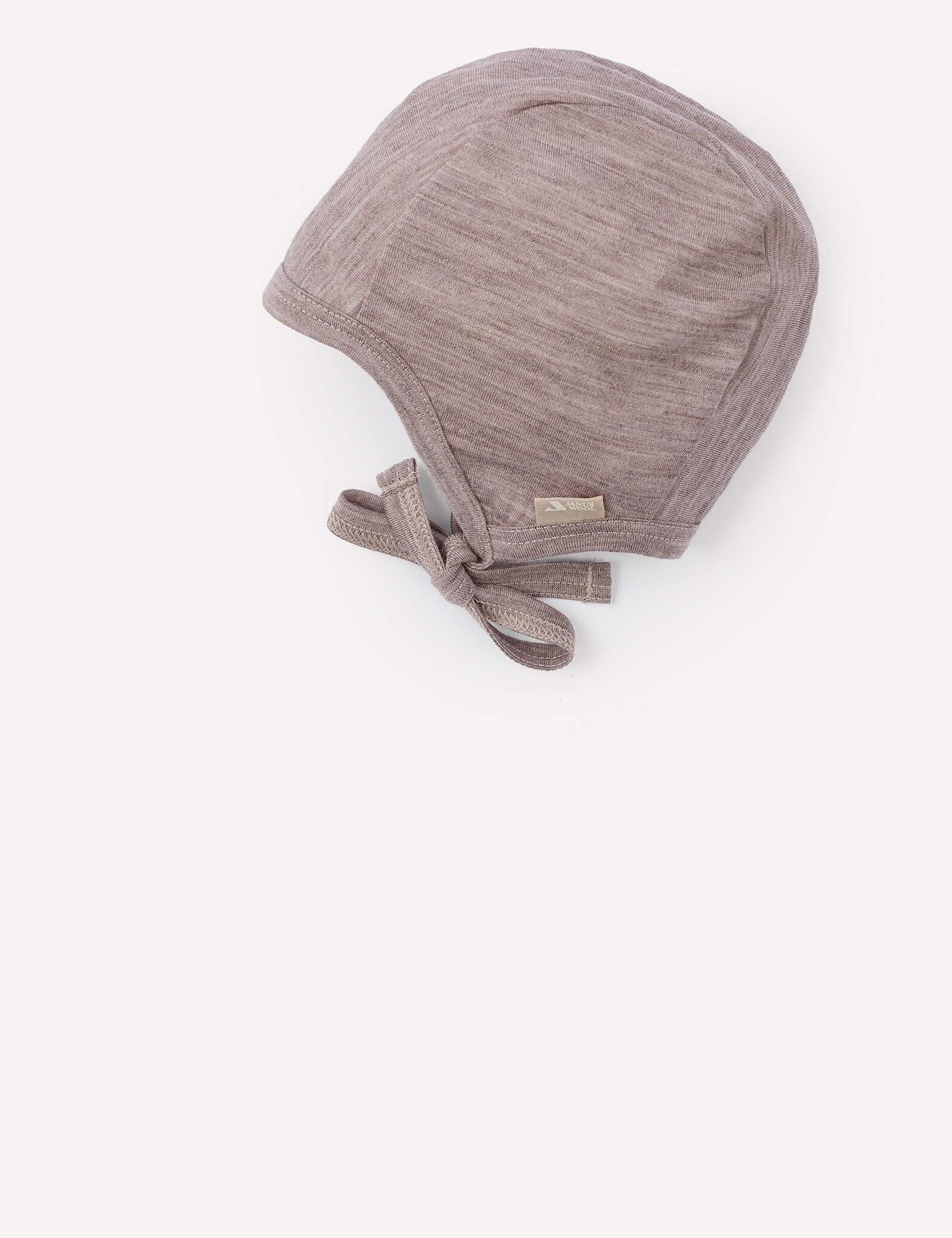 The Bonnet – Merino Baby Light is a light brown, textured merino wool bonnet featuring a lightweight tie under the chin, displayed against a plain white background.