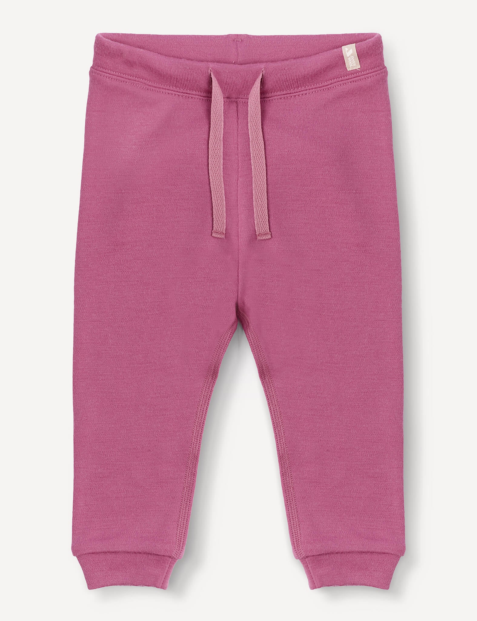 Merino Baby AirWool Pants in pink, featuring an adjustable drawcord waistband and ribbed cuffs, crafted from soft brushed AirWool, displayed on a plain white background.