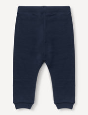 Pants – Merino Baby AirWool in navy blue, featuring an elastic waistband and cuffed ankles, crafted from brushed AirWool, laid flat on a white background.