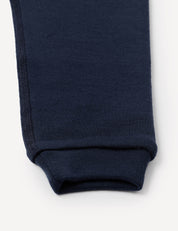 Close-up of the cuff of the Pants – Merino Baby AirWool in navy blue, highlighting the hem and stitching detail against a plain white background.