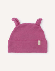 A Hawthorn Rose Beanie – Merino Baby AirWool featuring two small, pointy ear-like flaps on top and a folded brim with a petite fabric tag. Crafted for breathable insulation, it ensures cozy comfort for little ones.