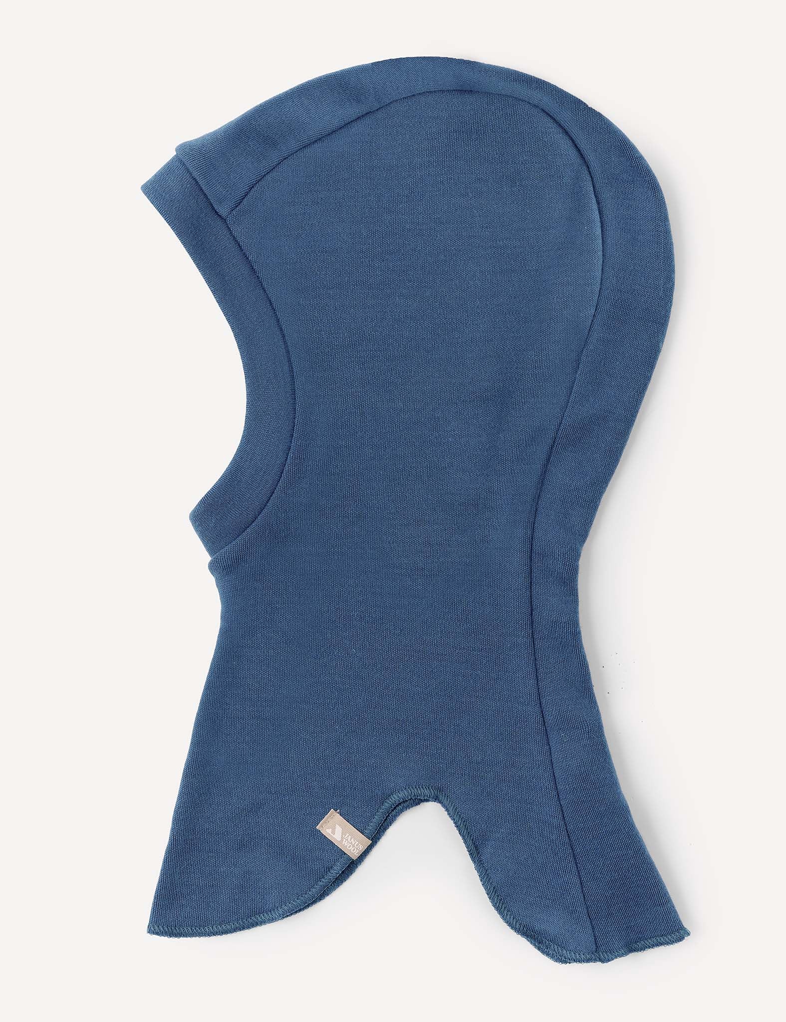 The Balaclava – Merino Kids AirWool is a blue, hood-shaped merino wool balaclava crafted from soft fabric, featuring a fitted head section and flared neck coverage, shown on a white background.