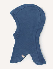 The Balaclava – Merino Kids AirWool is a blue, hood-shaped merino wool balaclava crafted from soft fabric, featuring a fitted head section and flared neck coverage, shown on a white background.