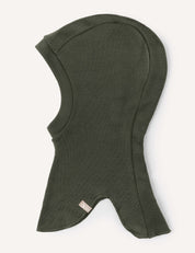 A warm balaclava in dark olive green, made from soft Merino Kids AirWool fabric, designed to cover the head, neck, and upper shoulders, and featuring a small fabric tag near the bottom edge.