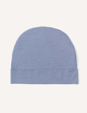 The Beanie – Merino Kids Light, a soft and lightweight wool beanie in plain light blue, is laid flat on a plain white background.
