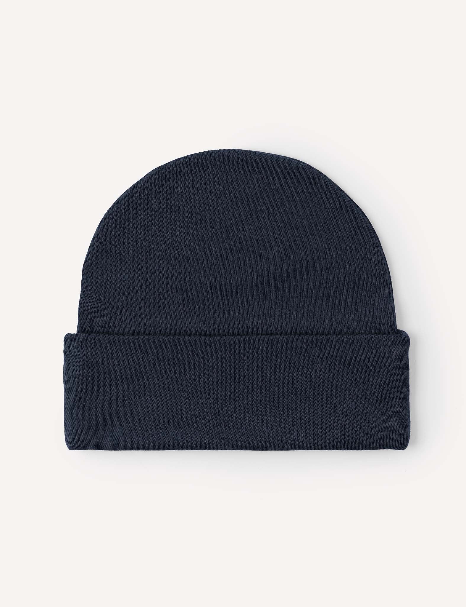 A Beanie – Merino Kids AirWool in navy blue, crafted from knit merino wool with a folded brim, is displayed flat on a light background.