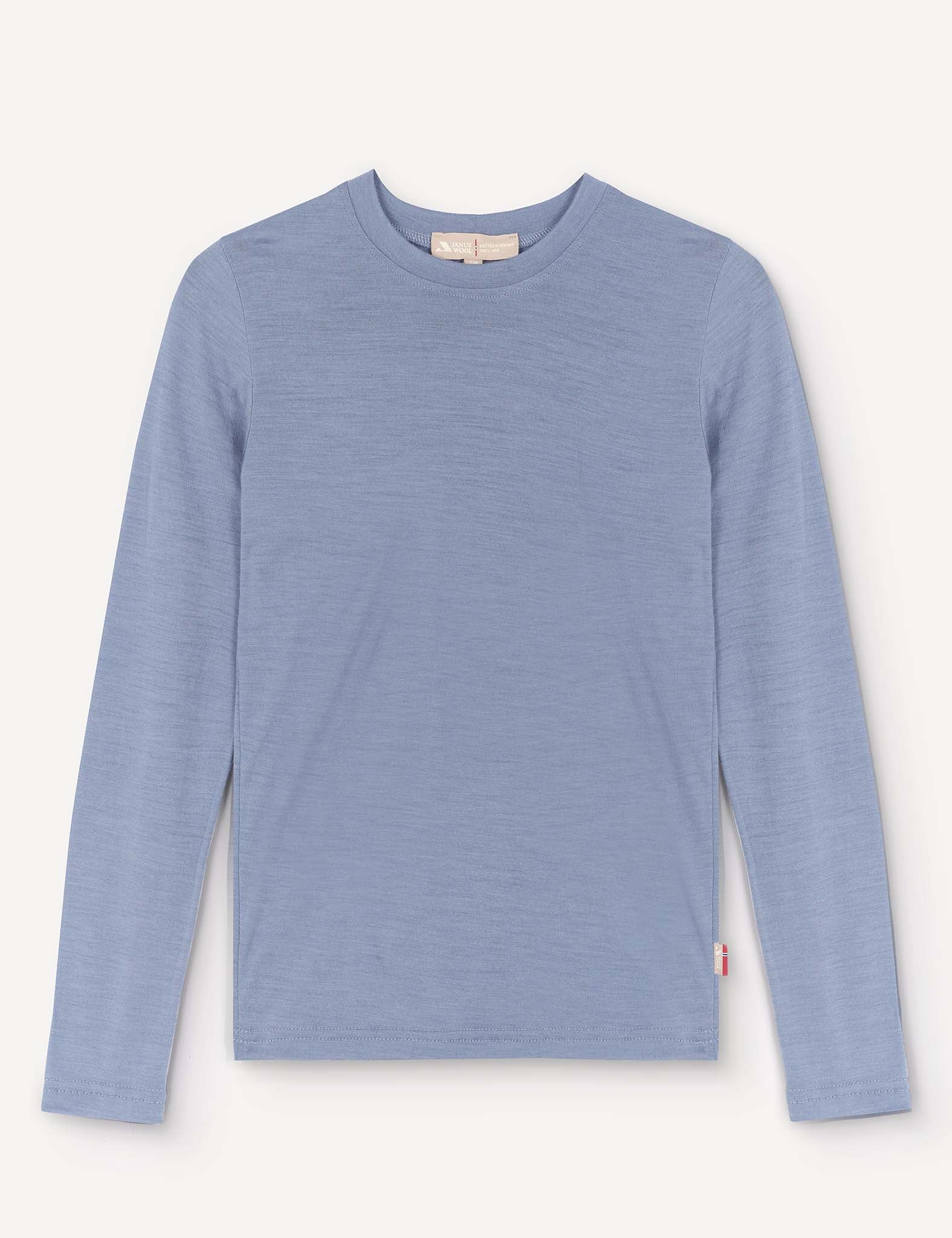 A Crewneck – Merino Kids Light shirt in Troposphere, featuring long sleeves and a crew neckline, is displayed laid flat on a plain background. Made from soft merino wool, the shirt has a simple design without visible patterns or logos, except for a small red tag on the lower side seam.