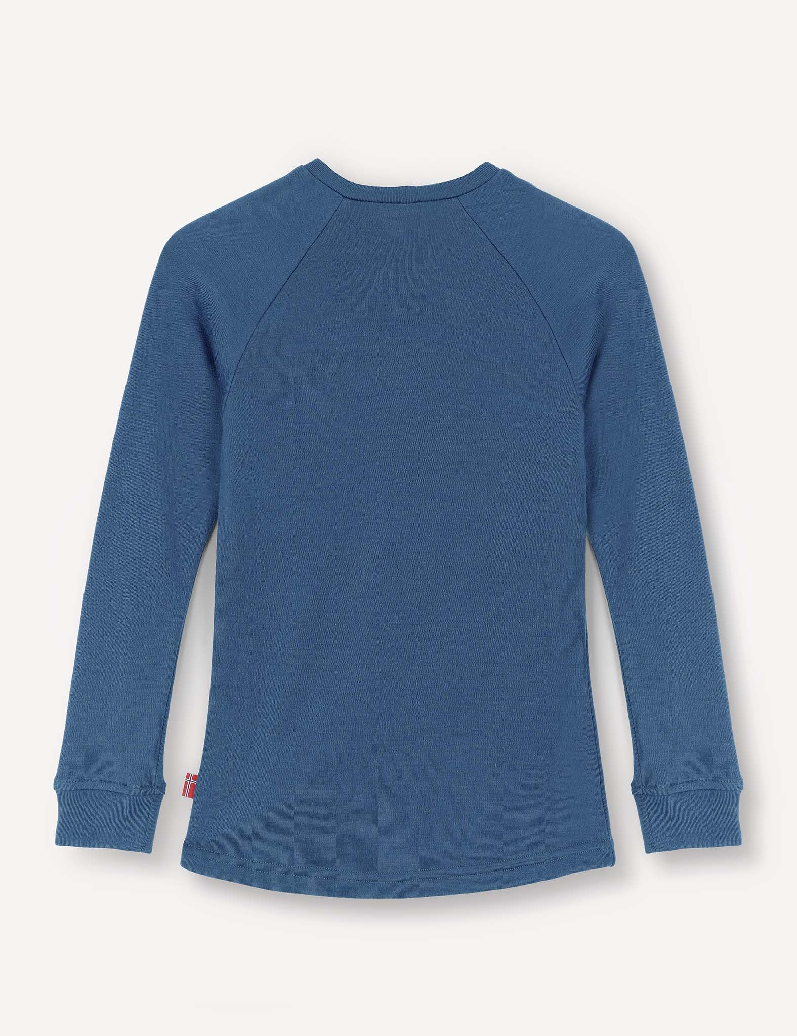 A blue Crewneck – Merino Kids AirWool long-sleeve jersey is laid flat with the back side facing up, highlighting its simple stitching and cuffed sleeves. Crafted from soft merino wool, it combines comfort with style.