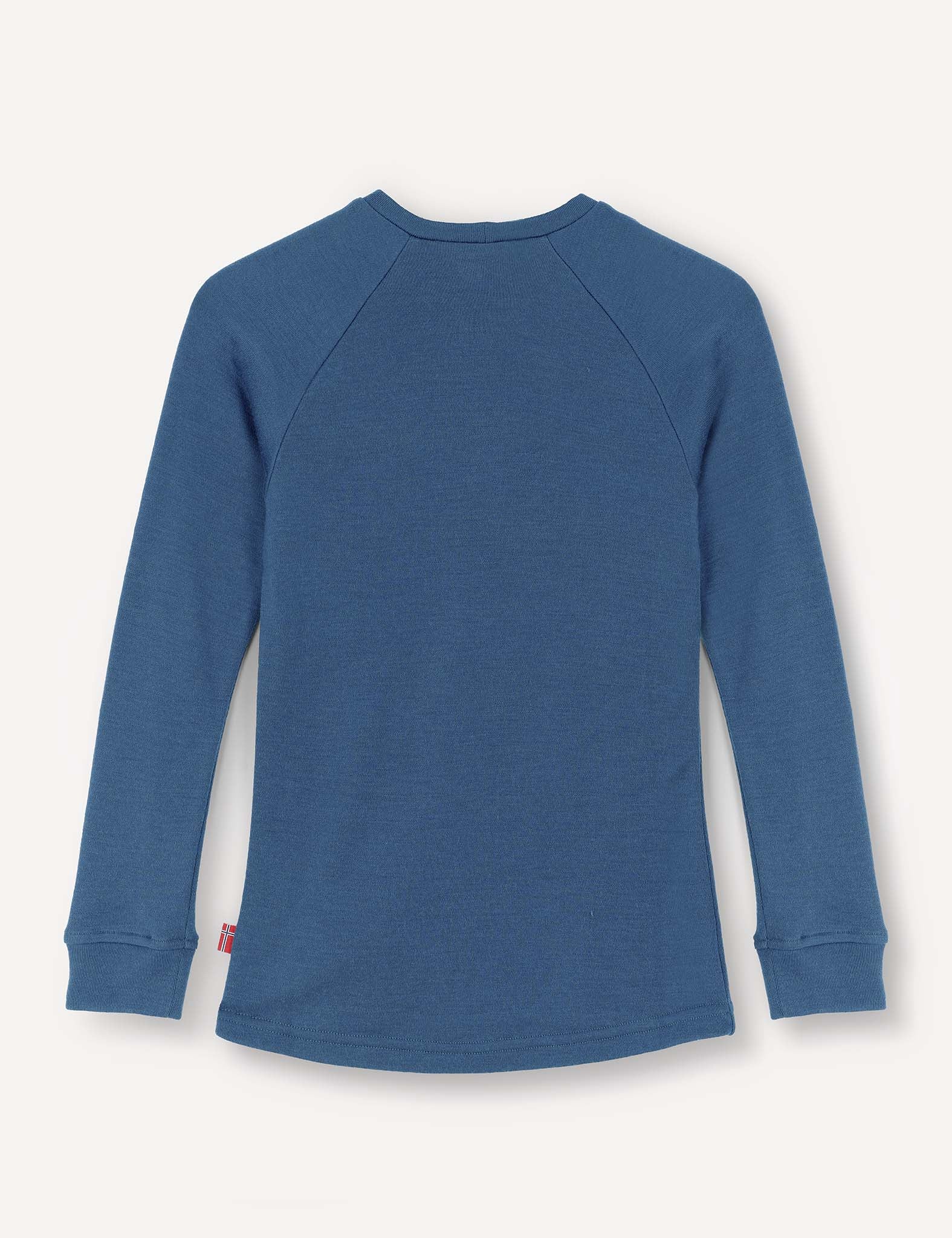 A blue Crewneck – Merino Kids AirWool long-sleeve jersey is laid flat with the back side facing up, highlighting its simple stitching and cuffed sleeves. Crafted from soft merino wool, it combines comfort with style.