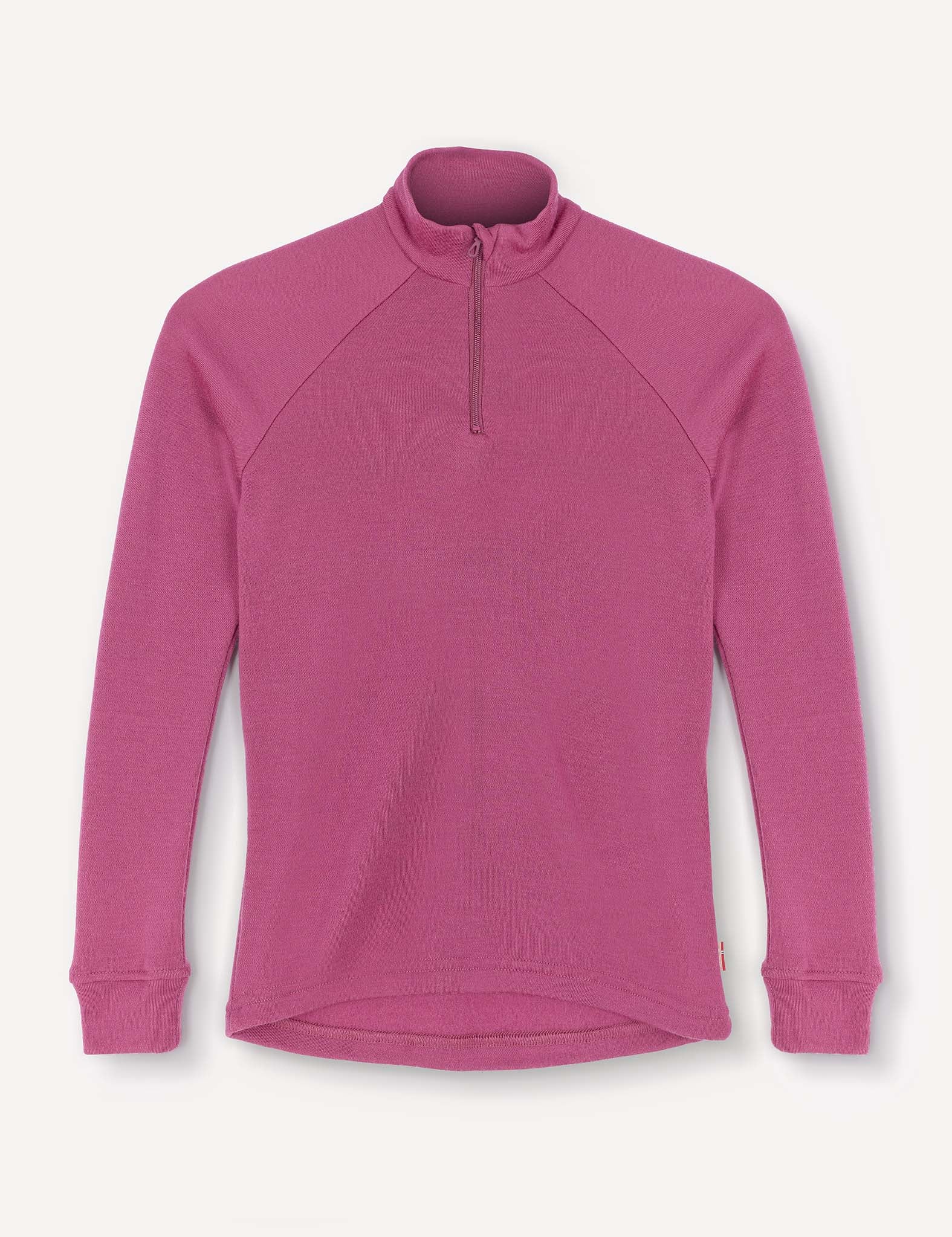 The Half Zip – Merino Kids AirWool is a magenta long-sleeve shirt with raglan sleeves, a high neck, ribbed cuffs, and a partial front zipper, displayed on a white background.