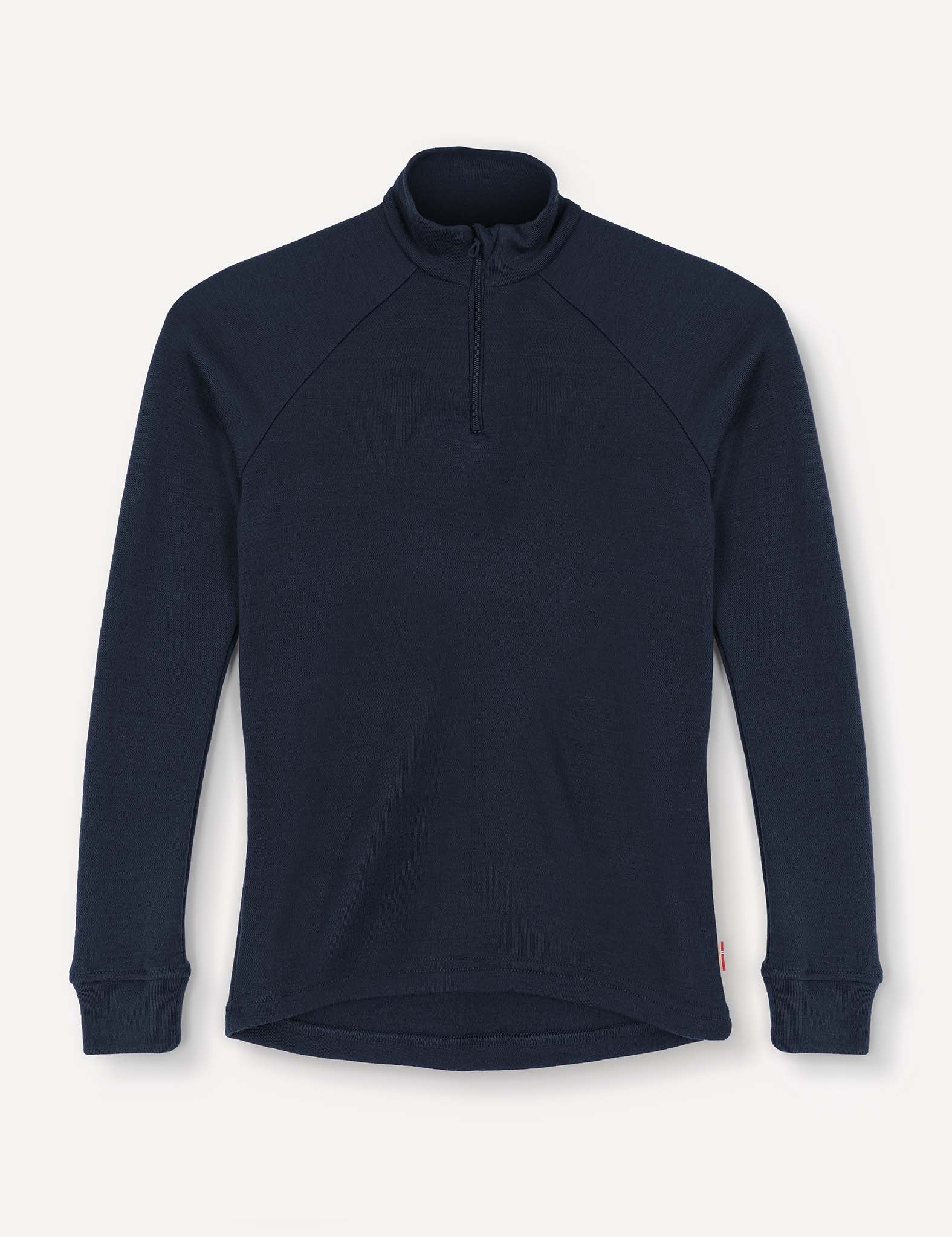 A navy Half Zip – Merino Kids AirWool pullover featuring long sleeves, a mock neck, and a quarter-zip front. Crafted from soft AirWool 260 fabric with slightly extended cuffs, the shirt is displayed flat against a plain white background.