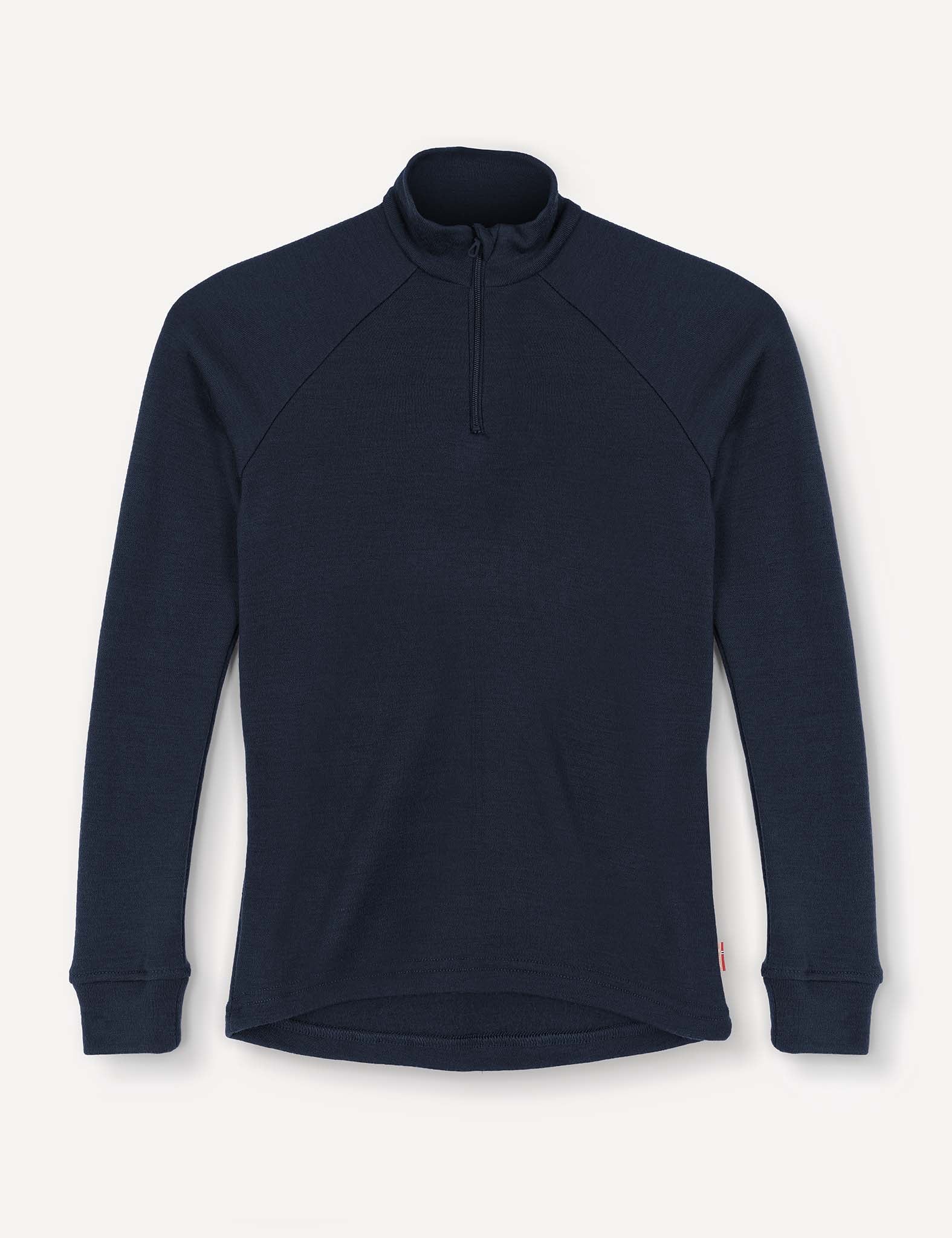 A navy Half Zip – Merino Kids AirWool pullover featuring long sleeves, a mock neck, and a quarter-zip front. Crafted from soft AirWool 260 fabric with slightly extended cuffs, the shirt is displayed flat against a plain white background.