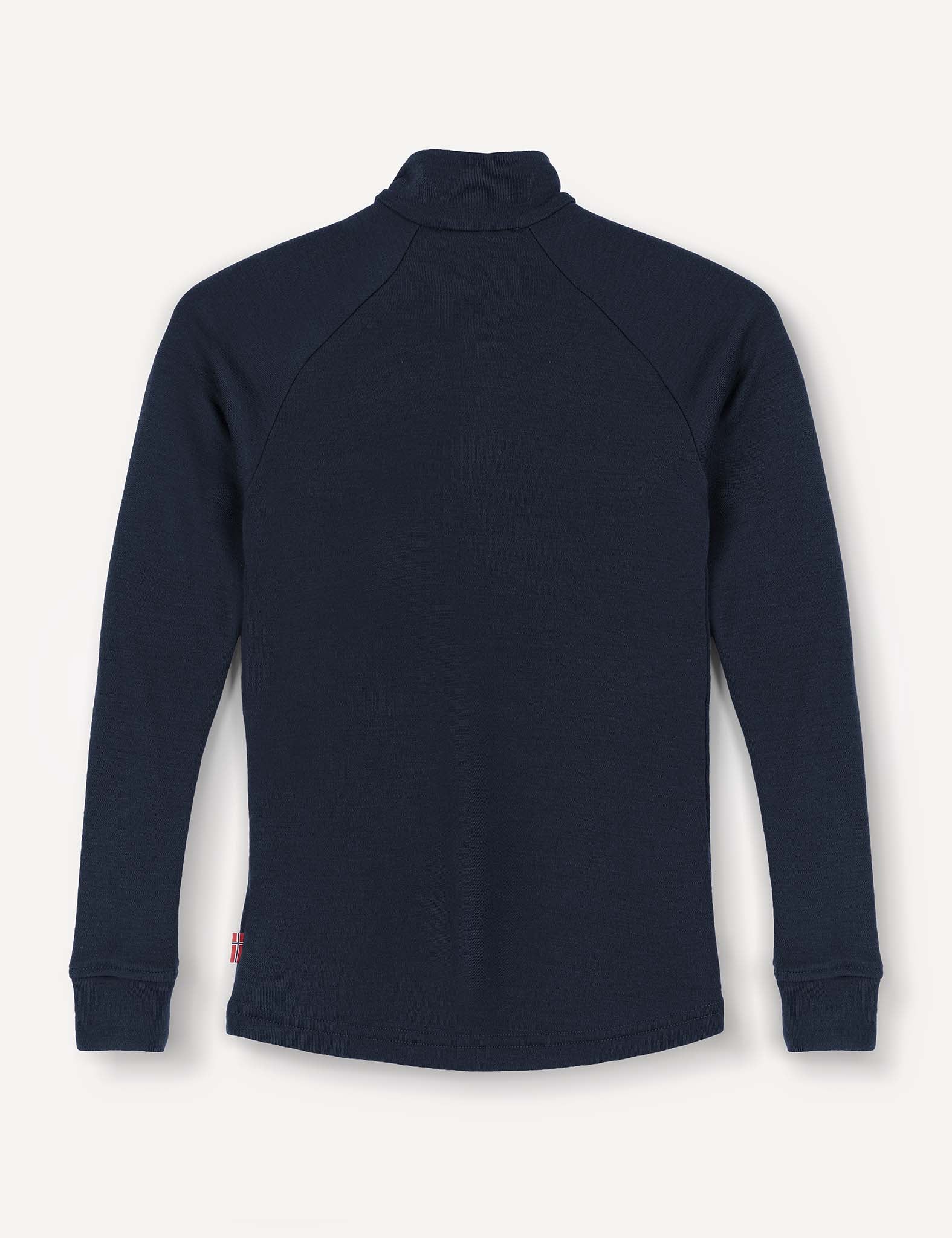 The Half Zip – Merino Kids AirWool shirt in navy blue is displayed from the back, laid flat on a light background, highlighting its raglan long sleeves and zip-up turtleneck design.