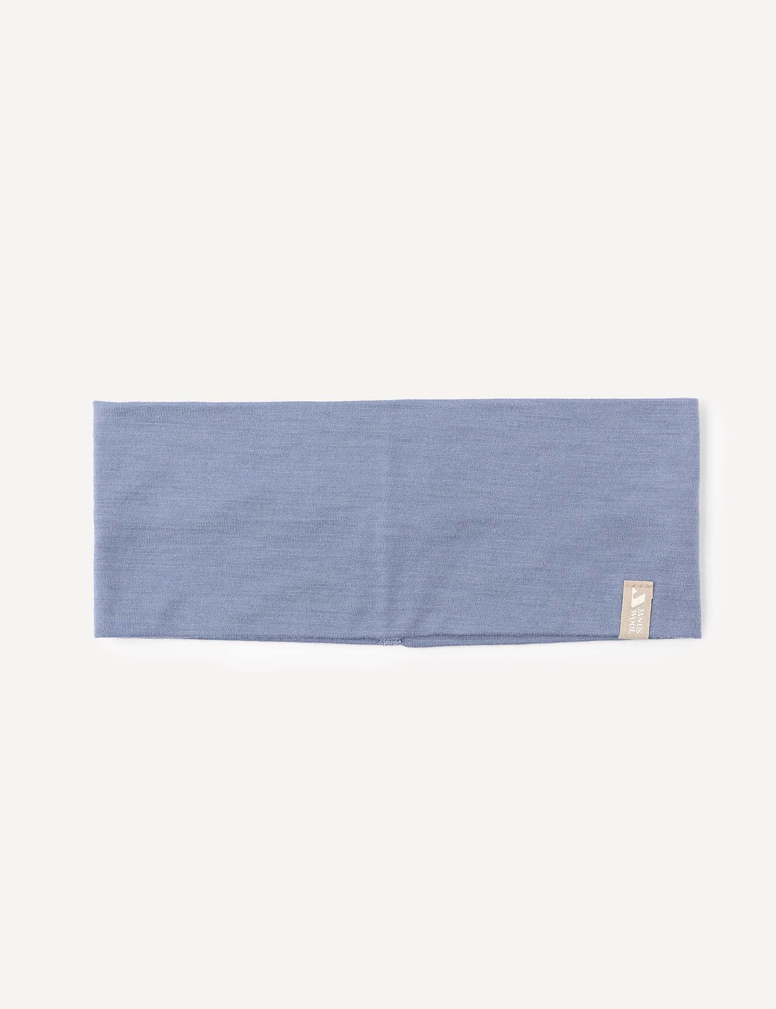 A folded, rectangular Troposphere-colored merino wool headband (Headband – Merino Kids Light) with a small beige fabric tag sewn on one corner, displayed on a plain white background.