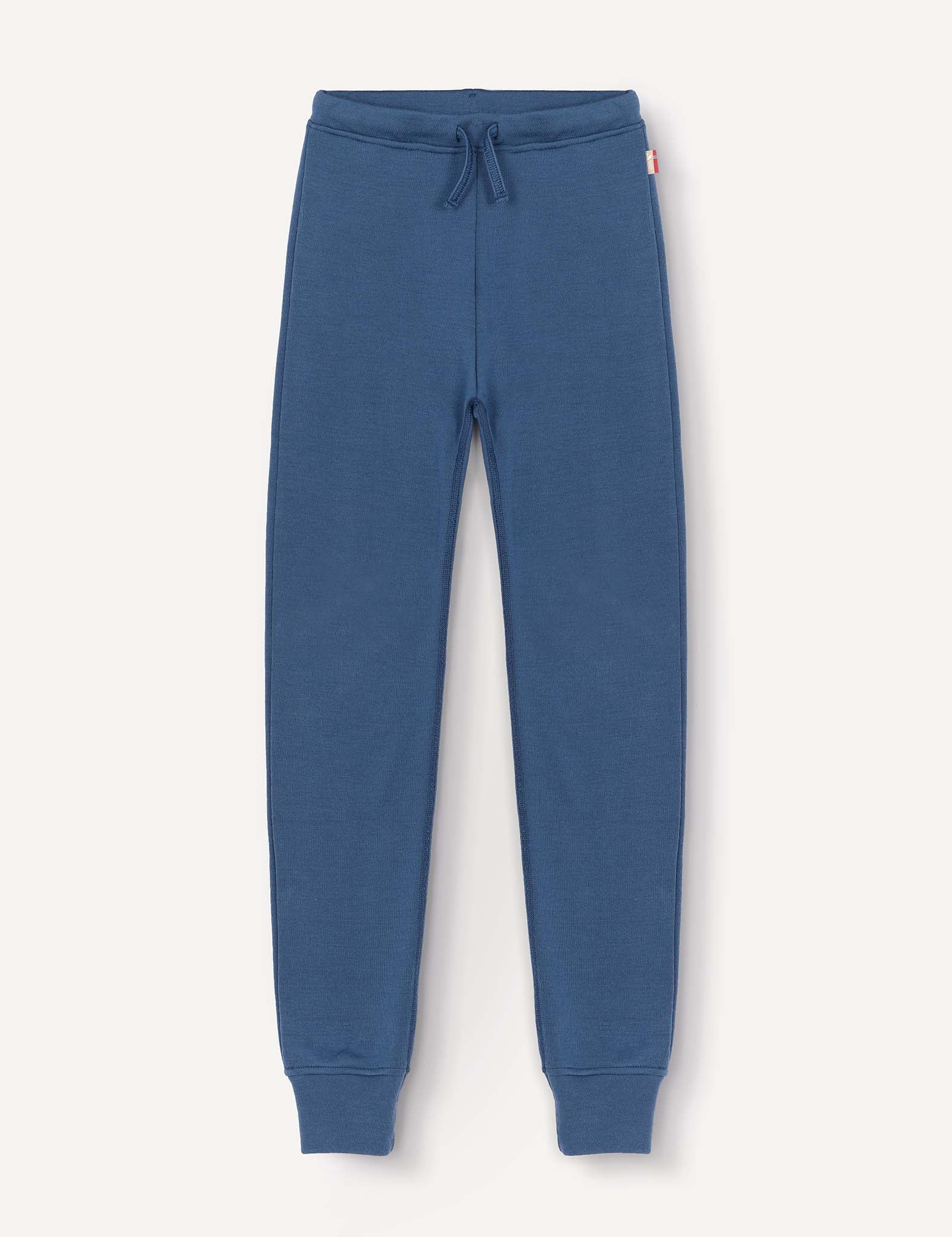 A pair of Merino Kids AirWool sweatpants in blue, featuring a warm design with an elastic waistband, drawstring, and cuffed ankles, displayed flat on a light background.