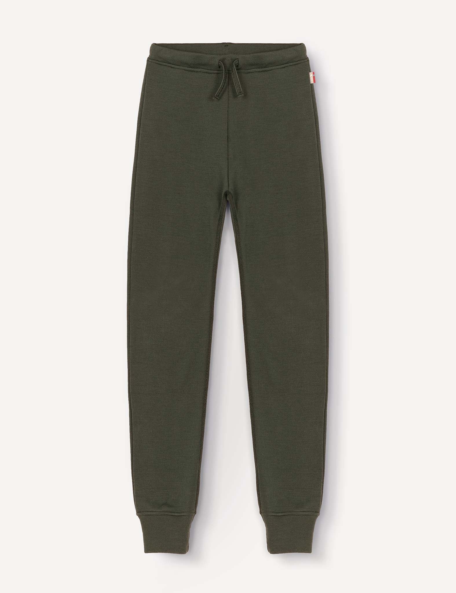 Merino Kids AirWool sweatpants in dark green, featuring a drawstring waistband, ribbed cuffs, and a small red and white tag on the side, laid flat on a light background.