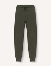 Merino Kids AirWool sweatpants in dark green, featuring a drawstring waistband, ribbed cuffs, and a small red and white tag on the side, laid flat on a light background.
