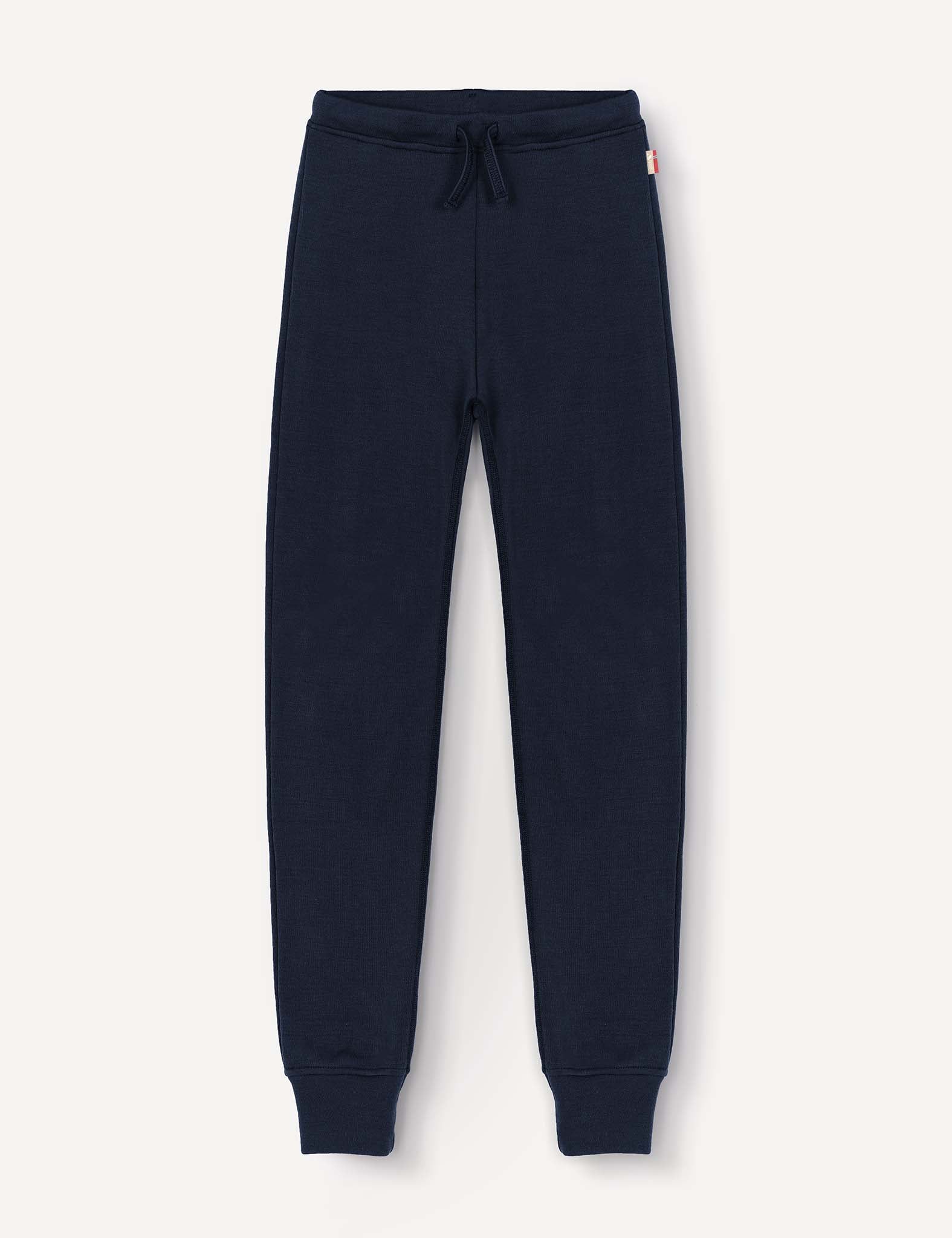 Merino Kids AirWool sweatpants in navy blue, featuring an elastic waistband with drawstring and ribbed cuffs, displayed flat on a light background.
