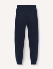 Sweatpants – Merino Kids AirWool in navy blue, featuring an elastic waistband and ankle cuffs, crafted from soft brushed AirWool, laid flat on a white background.
