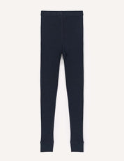A pair of Leggings – Merino Kids Classic Rib in plain, dark navy blue merino wool is laid flat on a white background, showcasing visible seams, ankle cuffs, and an elastic waistband.
