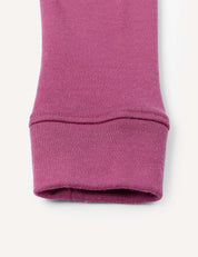Close-up of the cuff of the Leggings – Merino Kids AirWool, made from pinkish-purple AirWool knit fabric, shown against a plain white background.