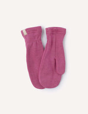 A pair of Mittens – Merino Kids AirWool in pink is laid flat on a light background, with one mitten slightly overlapping the other. A small beige tag is sewn onto the cuff of one mitten.