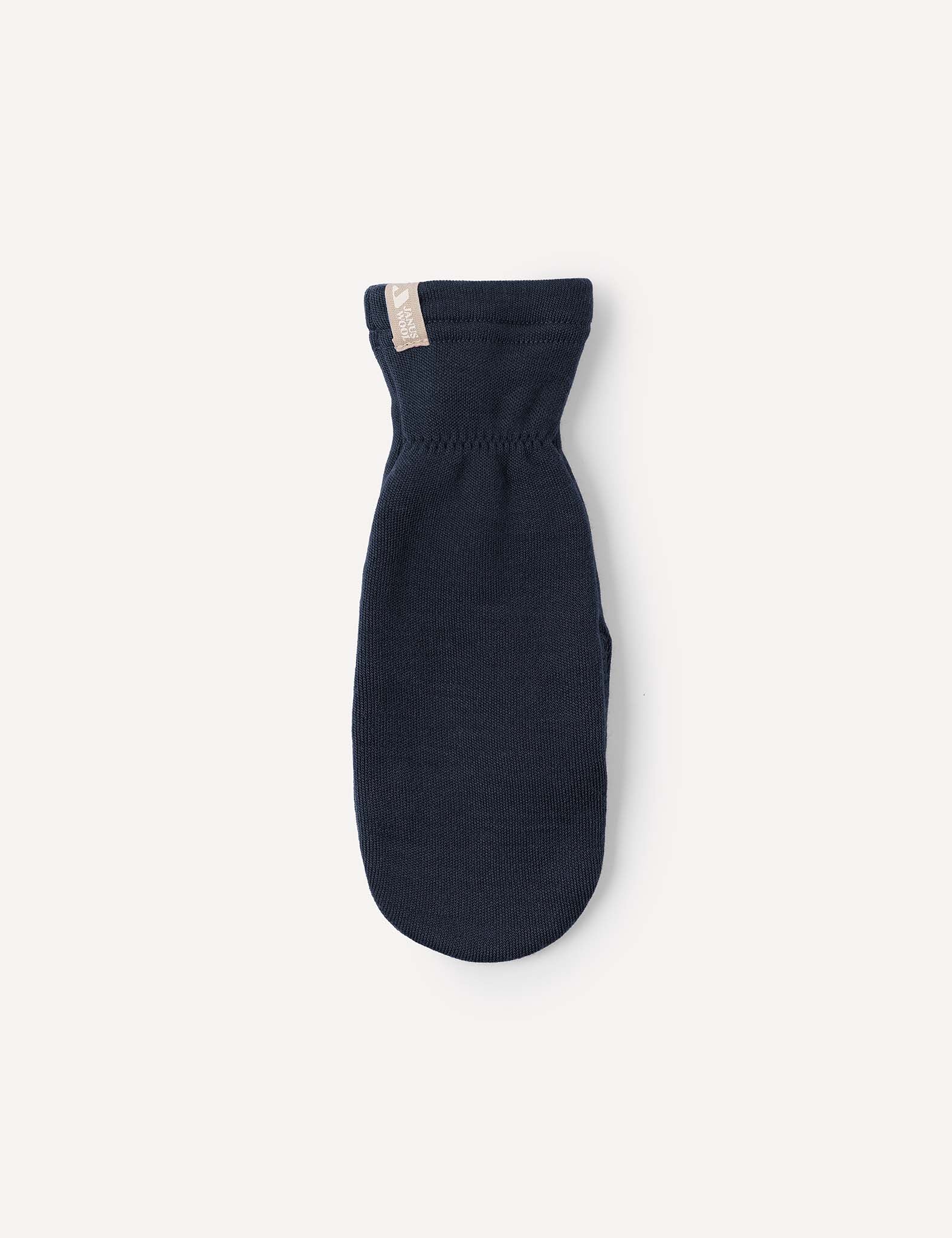 A single navy blue Merino Kids AirWool mitten, crafted from warm wool and featuring a small beige tag at the cuff, is displayed on a plain light background.