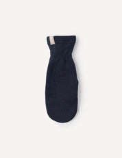 A single navy blue Merino Kids AirWool mitten, crafted from warm wool and featuring a small beige tag at the cuff, is displayed on a plain light background.