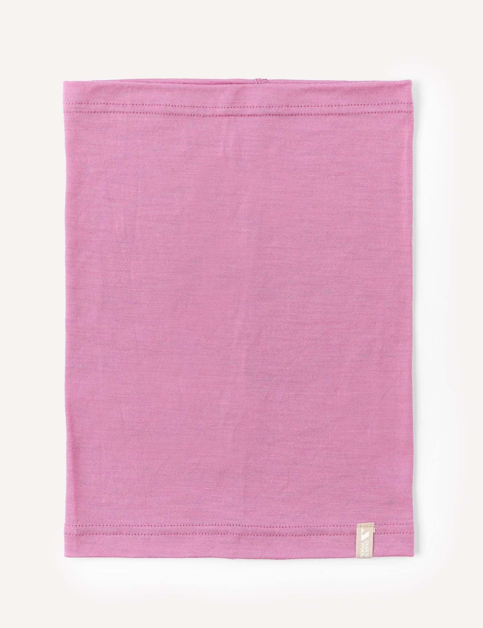 A mauve orchid, rectangular Neckwarmer – Merino Kids Light is laid flat on a white background, featuring visible stitching along the top and bottom edges and a small white tag sewn near one corner.