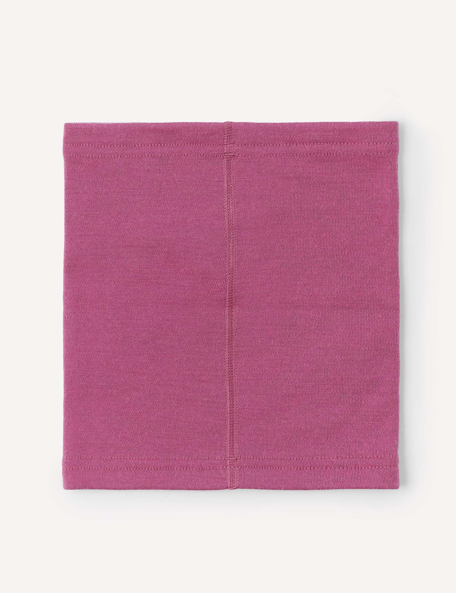 A flat, rectangular piece of pink fabric with a visible seam down the center, likely the Neckwarmer – Merino Kids AirWool, displayed on a plain light background.