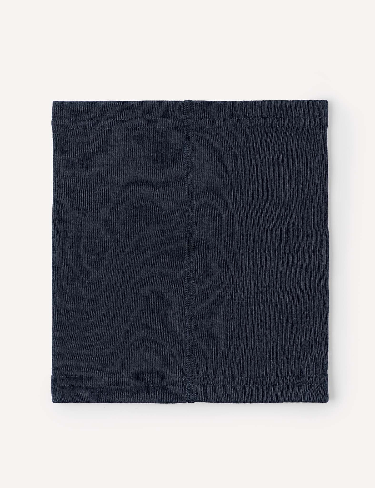 The Merino Kids AirWool Neckwarmer is shown in navy blue, featuring simple stitching and laid flat on a light background. This rectangular cloth tube has a plain design with visible seams running vertically and along the top and bottom edges.