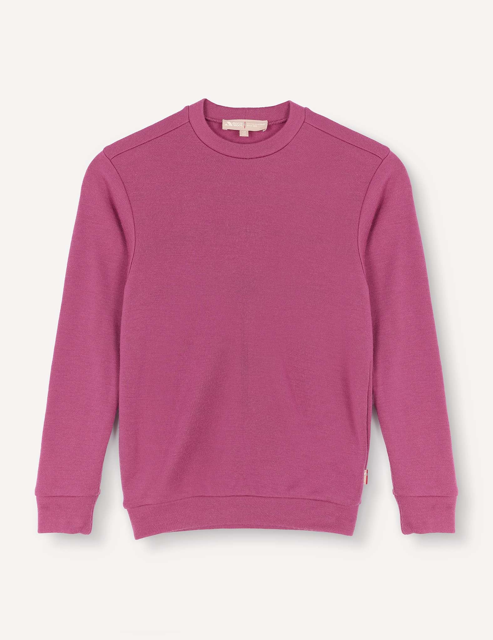 A Pullover – Merino Kids AirWool sweater in a solid magenta color, featuring long sleeves and a crew neck, is laid flat on a white background.