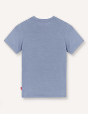 The T-Shirt – Merino Kids Light is shown from the back against a white background, featuring a plain light blue design with short sleeves made from merino wool for natural temperature regulation and all-day comfort.